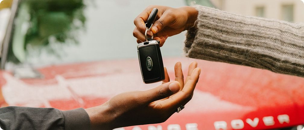 Red car key handover