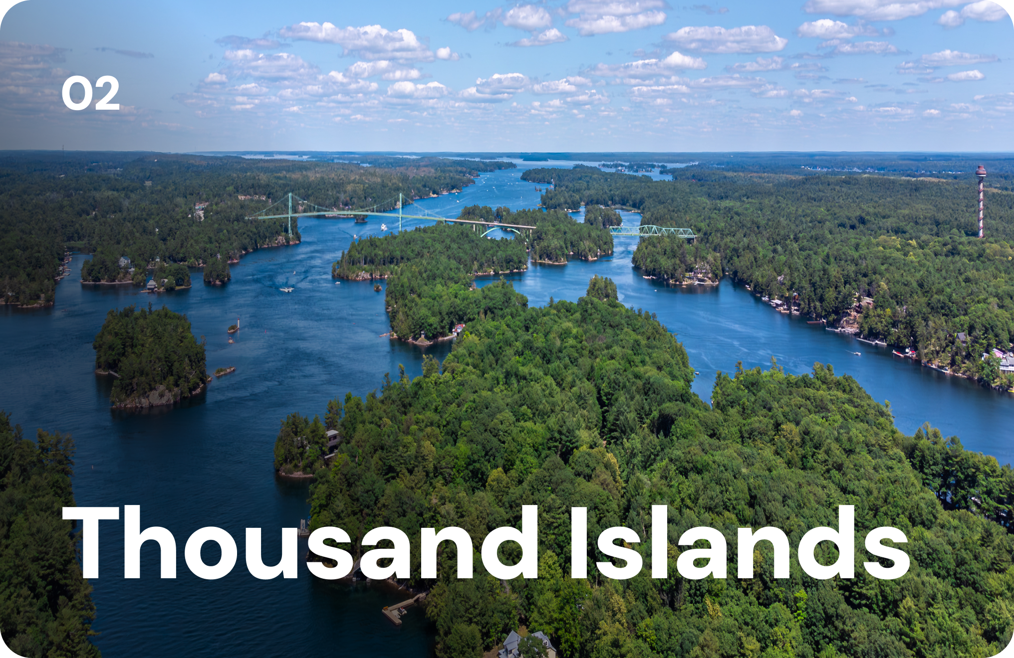 An aerial view of lush green islands scattered across the blue Saint Lawrence River. 02 Thousand Islands