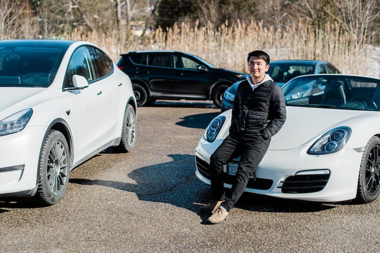 Turo car sharing entrepreneurs standing in front of rental car fleet