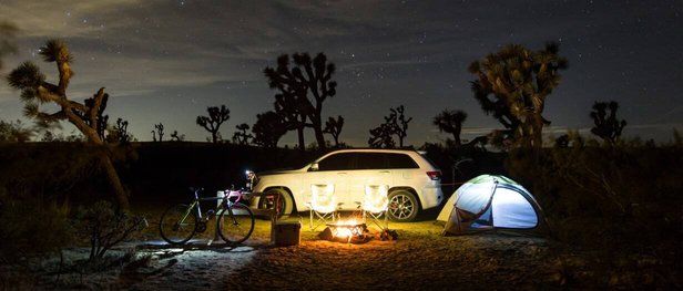 White Jeep parked in Joshua Tree desert
