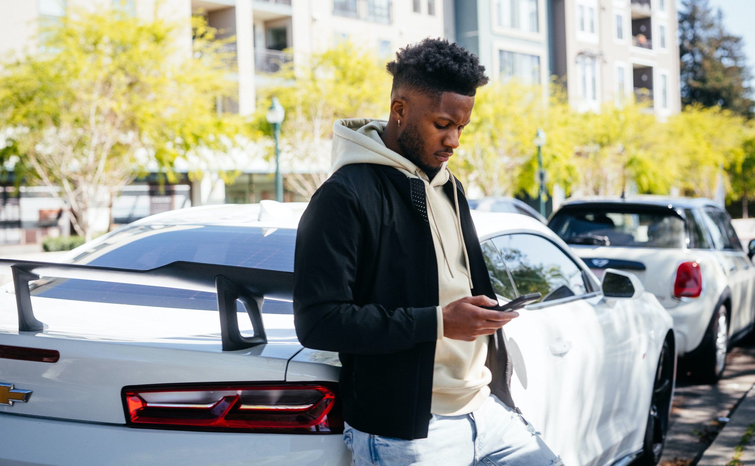 Michael J. posing with one of his listed cars