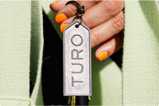 hand holding Turo keychain