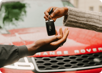 car key being passed between hands