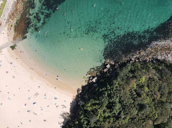 A drone shot of Shelly Beach in Manly, a popular location to visit for people who are renting a car in Manly.