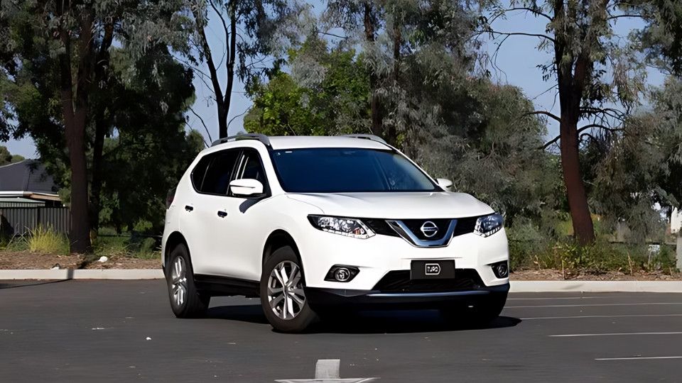 A Turo guest stands next to a Polestar rental car in Melbourne, with the beach in the background