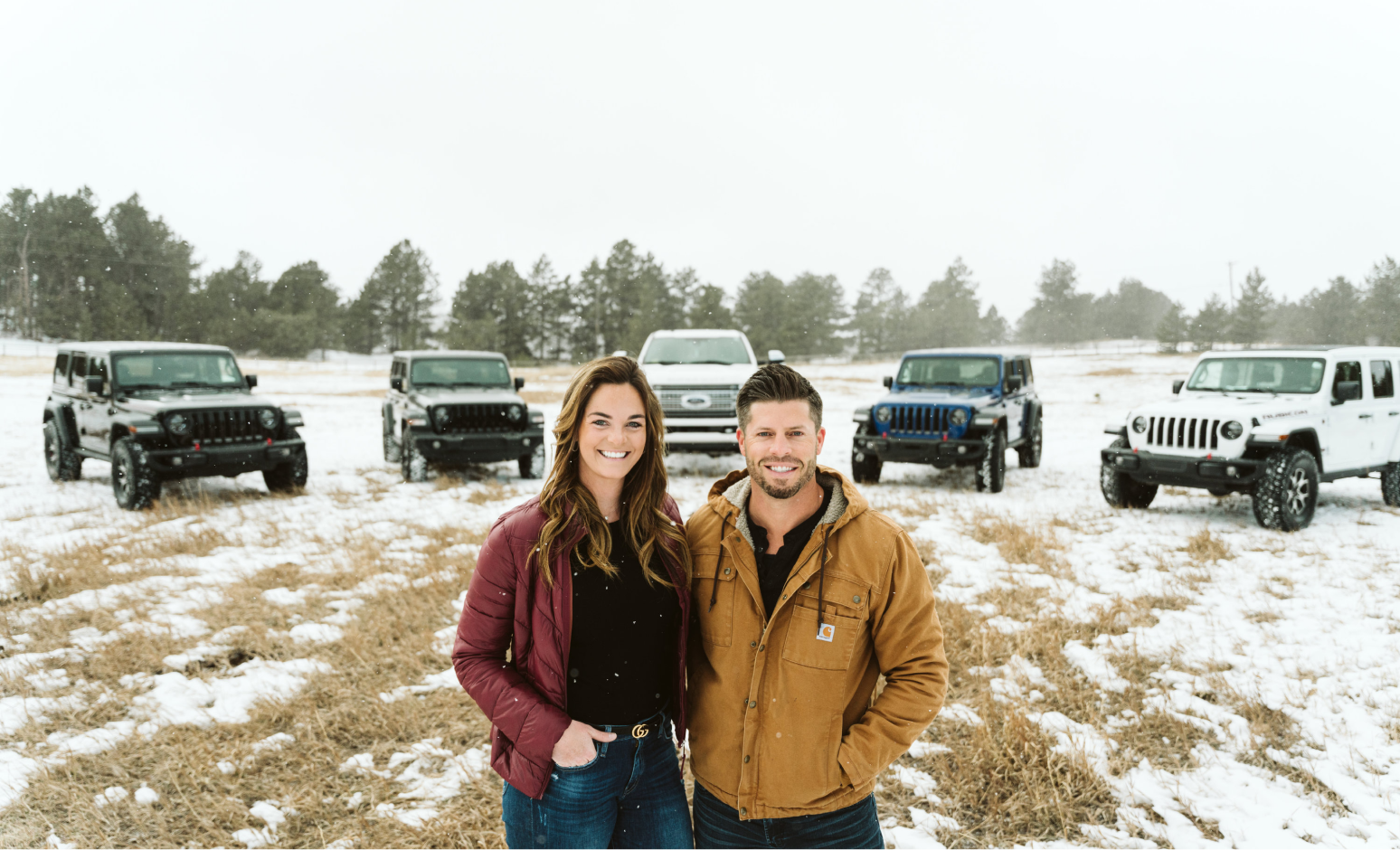 Turo car sharing entrepreneurs standing in front of rental car fleet