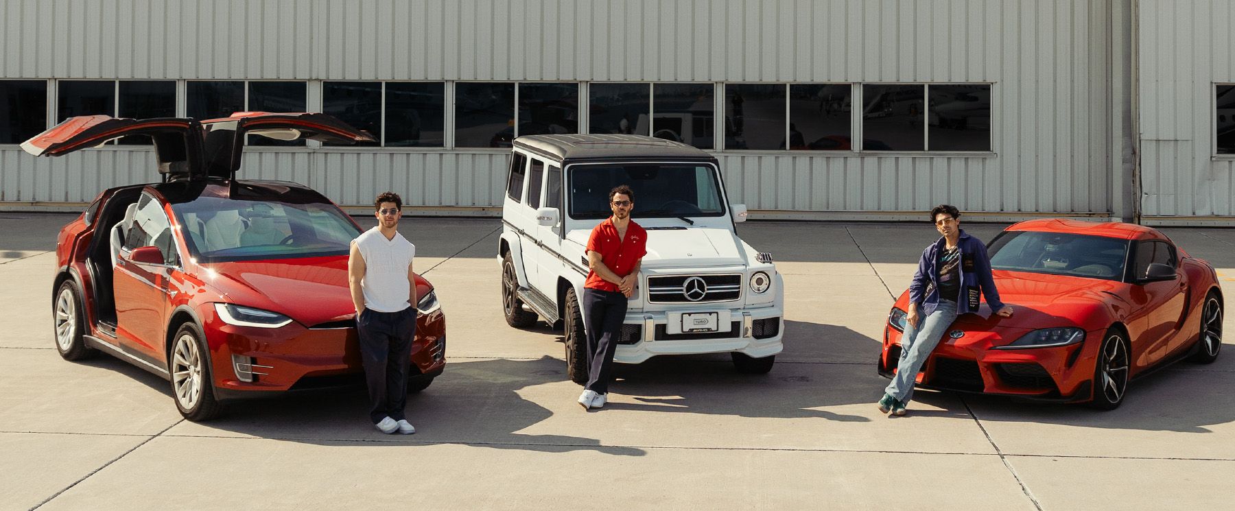 Turo host and small business entrepreneur Michael J. smiling in front of cars