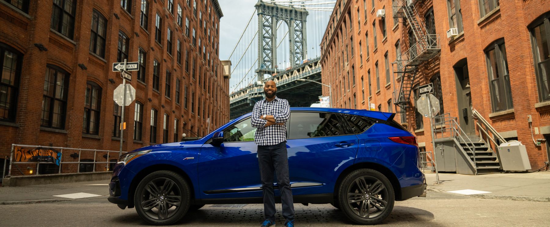 Turo host and small business entrepreneur Michael J. smiling in front of cars