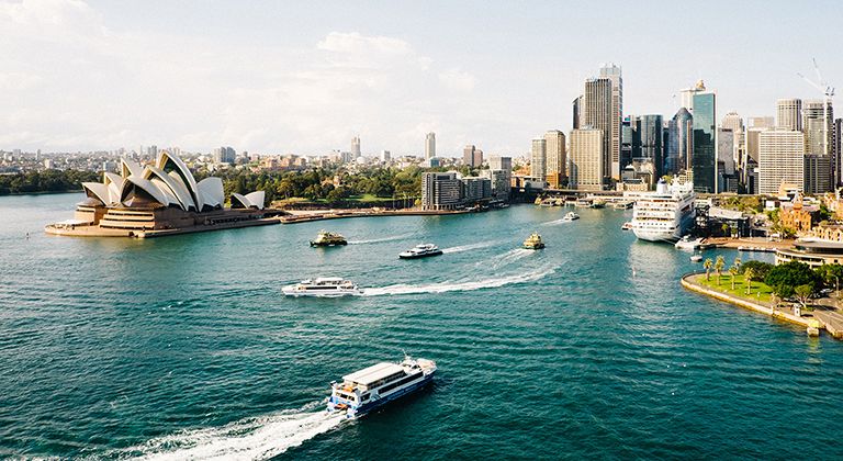 Sydney Opera House along Sydney Harbour, a popular car rental Sydney pickup location for visitors.